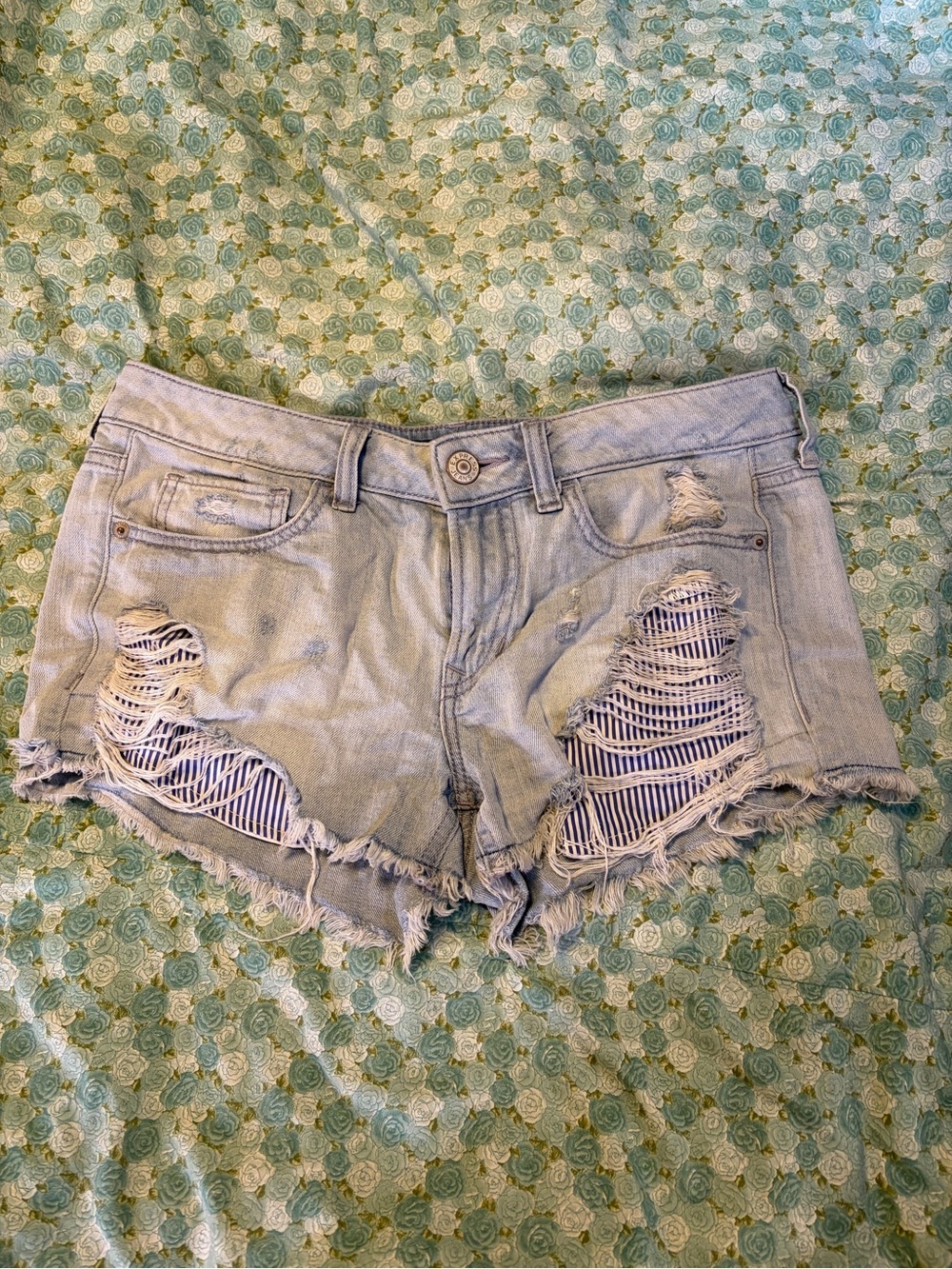 Distressed Light Blue Jean Cutoff Shorts with Striped Underlay